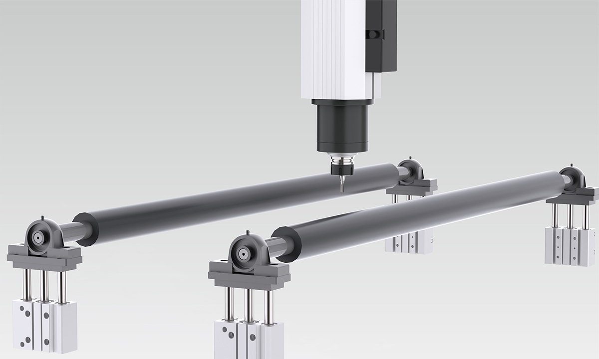 Pneumatic roller hold-down system in the routing area